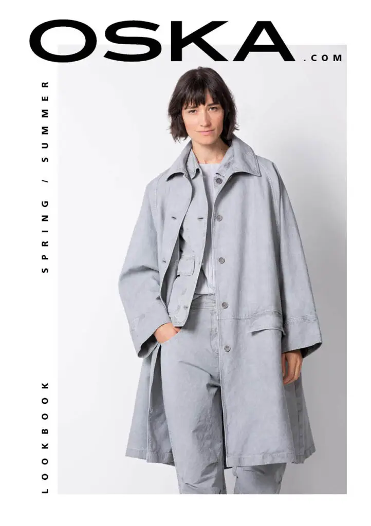 Model in a light grey coat on the OSKA lookbook cover