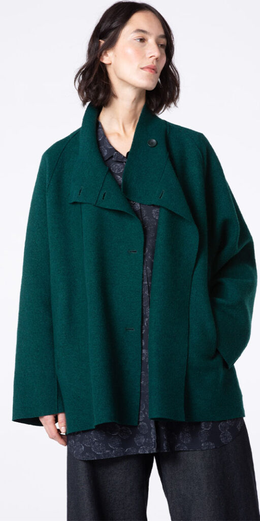 Woman in a stylish green coat.
