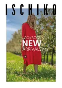 Model in red dress in a lush field