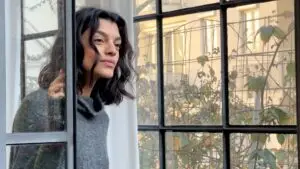 A person looking out a window.
