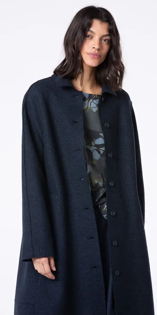 Woman wearing a dark coat.