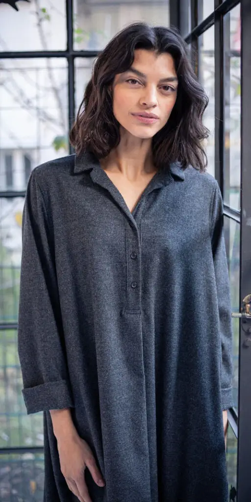 Woman in a stylish gray shirt dress