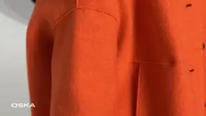 Close-up of an orange wool coat