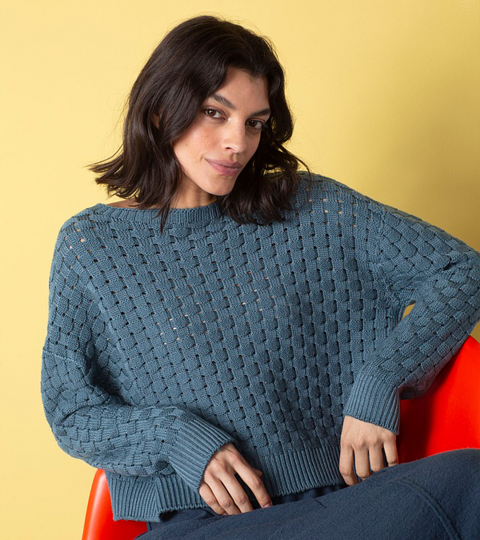 Model in a cozy blue sweater