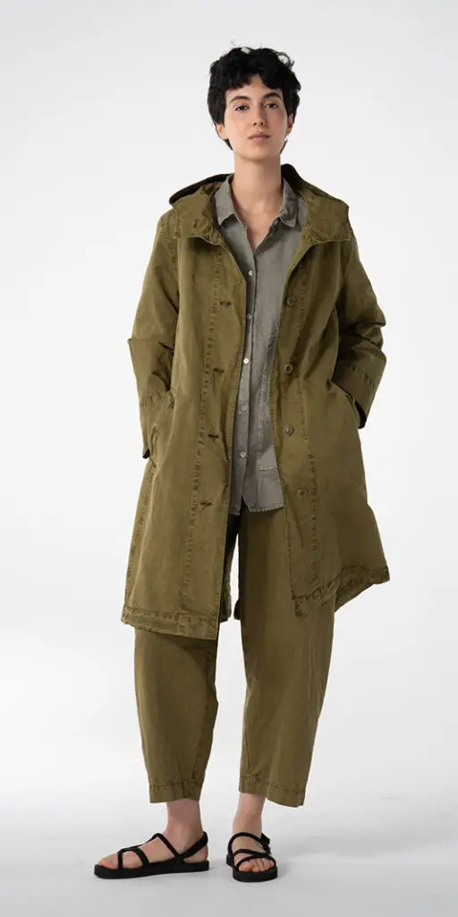 Person modeling a stylish olive green outfit.