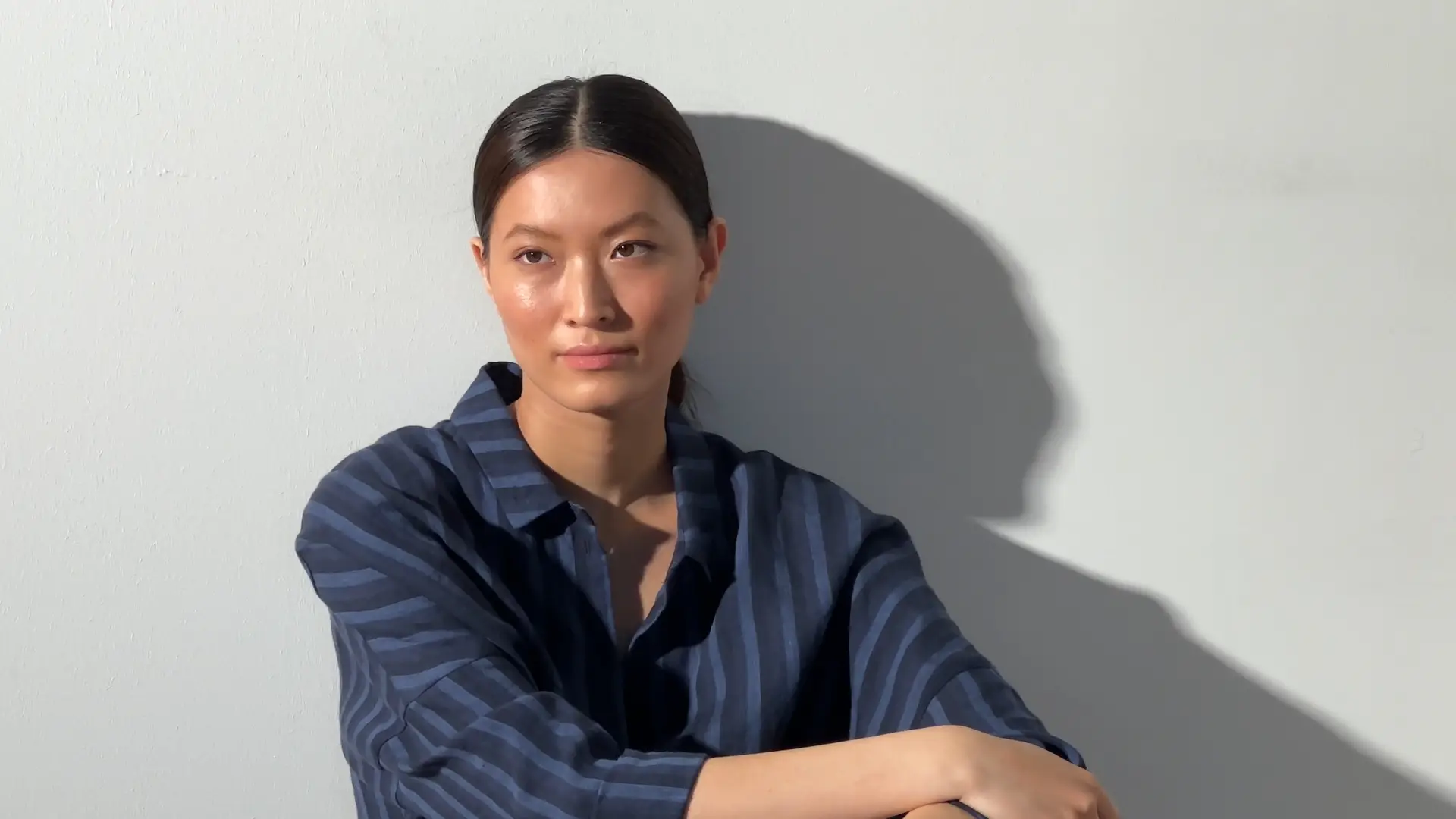 Person with a neutral expression against a light background.