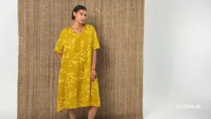 Model wearing a yellow floral dress