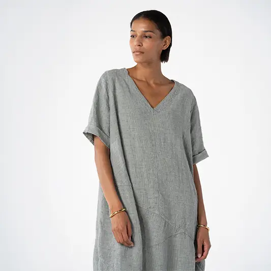 Woman in casual gray V-neck dress