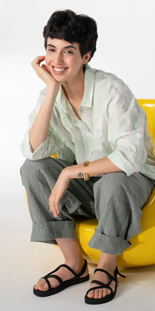 Young woman sitting in a colorful chair