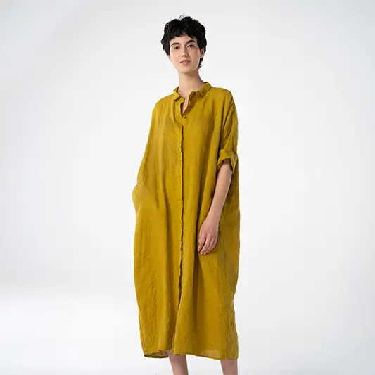 Model in a yellow linen dress