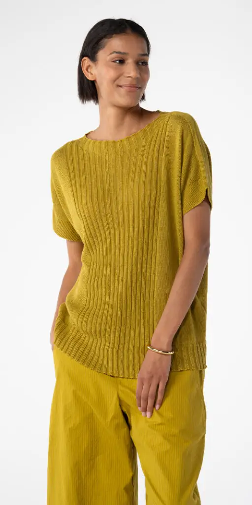 Woman wearing a mustard yellow outfit