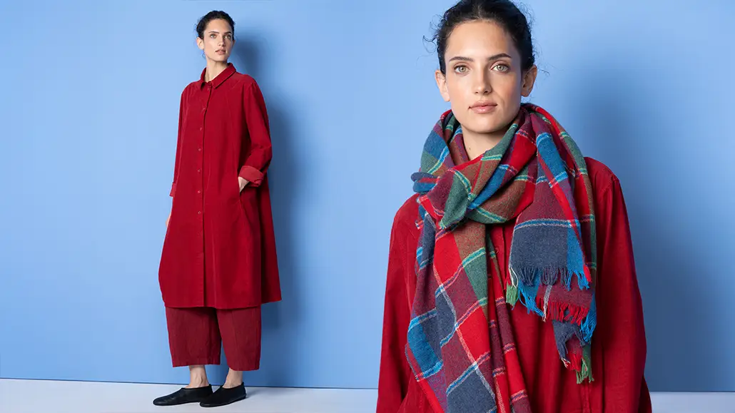 Woman in red outfit with plaid scarf