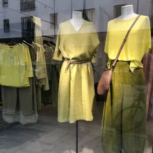Display of stylish green and yellow clothing.