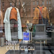 Store window display featuring new clothing collection.